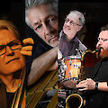 The picture shows a collage of four portrait photos of jazz musicians playing or holding various instruments. From left to right, you can see a woman with glasses, an older man with grey hair, a man with glasses playing the drums and a bearded man with a saxophone.